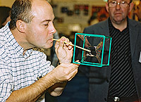 A delegate blows unusual-shaped bubbles