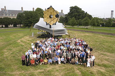 JWST team in front of real-size scale model