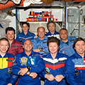 Crewmembers pose for group photos in Harmony