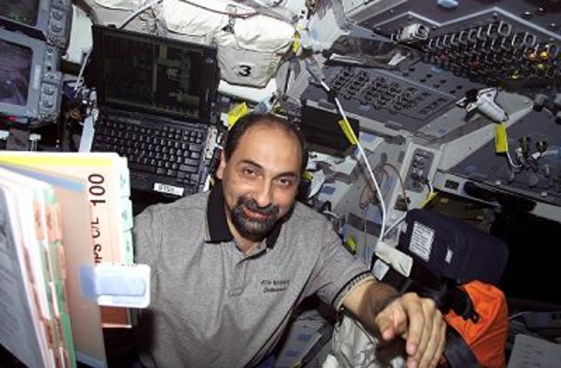 Astronaut Umberto Guidoni on Endeavour's flight deck