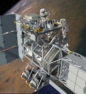 Astronauts working at an external payload site on the ISS Truss Assembly