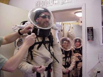 Bill Clancey, Nancy Wood and Andrea Fori in EVA suits getting ready