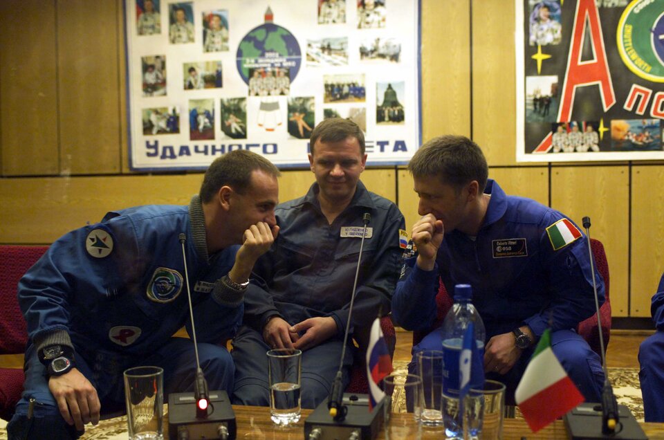 The Marco Polo mission crew share a joke during the press conference at Baikonur Cosmodrome, Kazakhstan