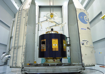MSG's payload fairing half-shells are moved into position around MSG-1
