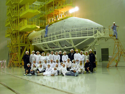 3.10.02.  International team in front of the Proton fairing