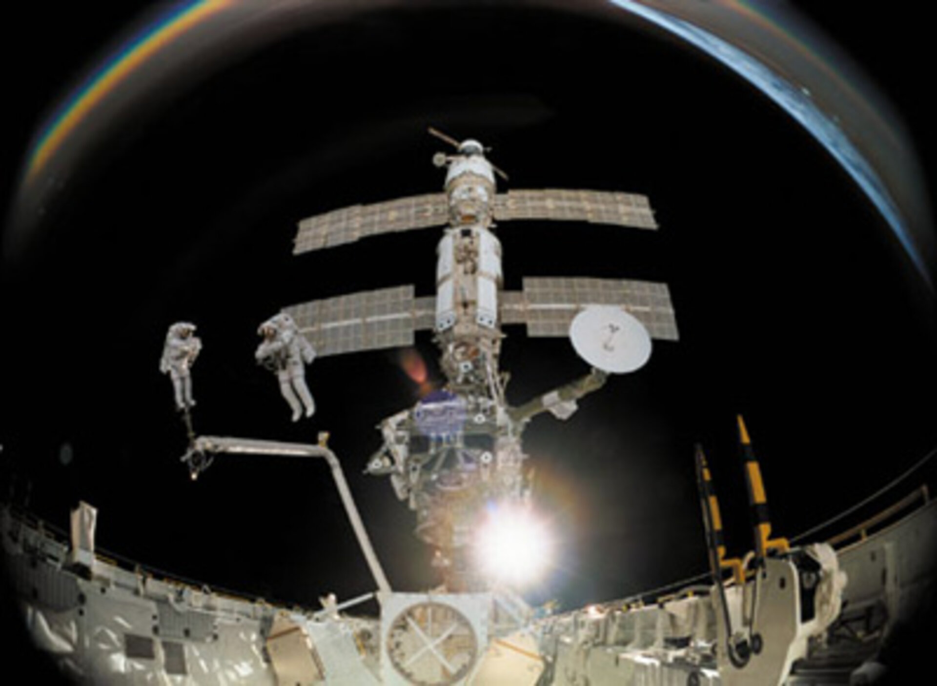 Scene from the IMAX film: ISS reflected in an astronaut's helmet