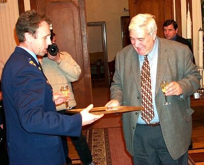 Sergei Zaletin presents a photo of the crew to Yuri Koptev