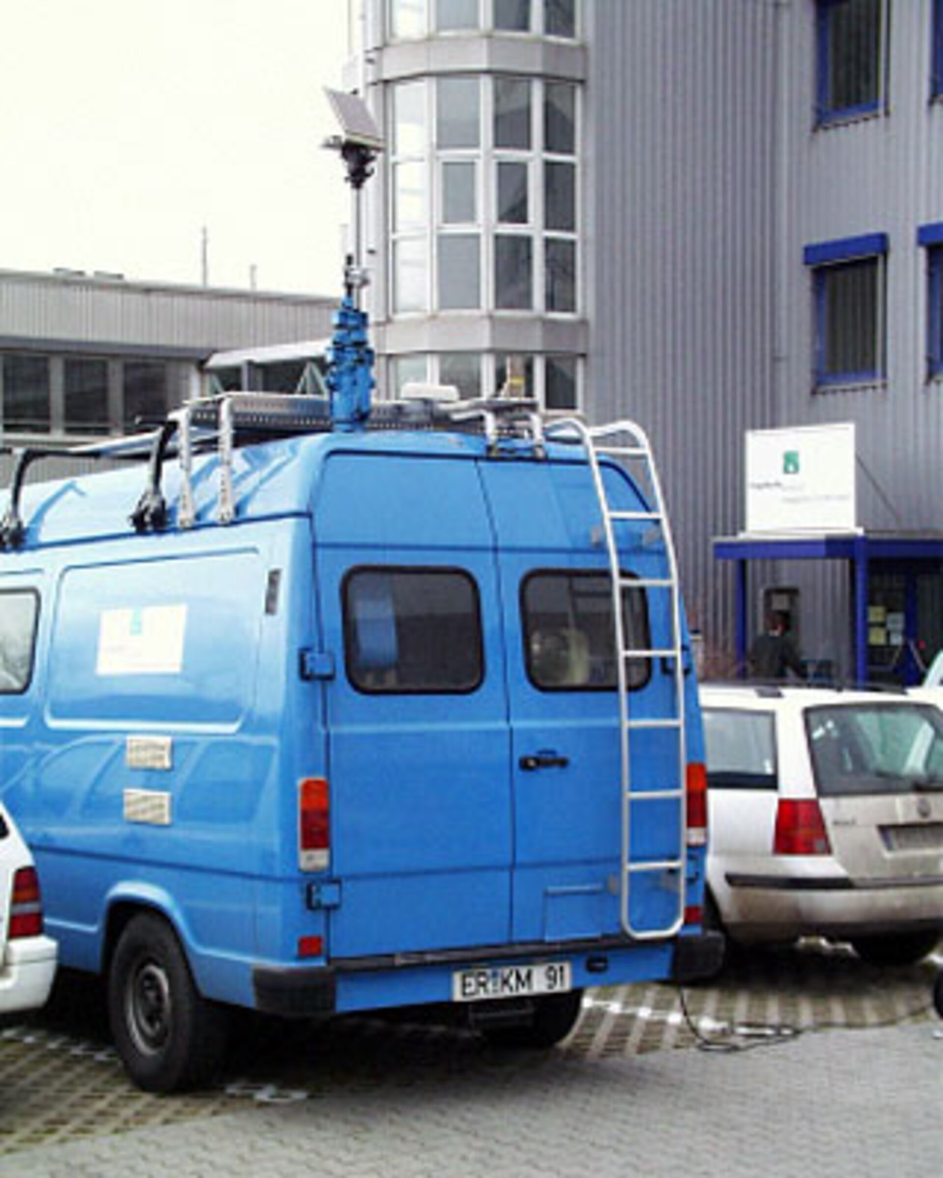 Antenna mounted on van to measure signal reception