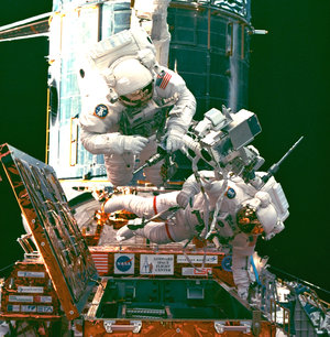 An EVA during STS-82, a servicing mission for the Hubble Space Telescope (HST)