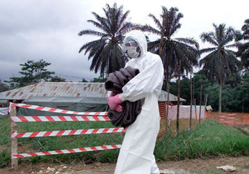 Health workers wear protection against the highly infectious Ebola virus