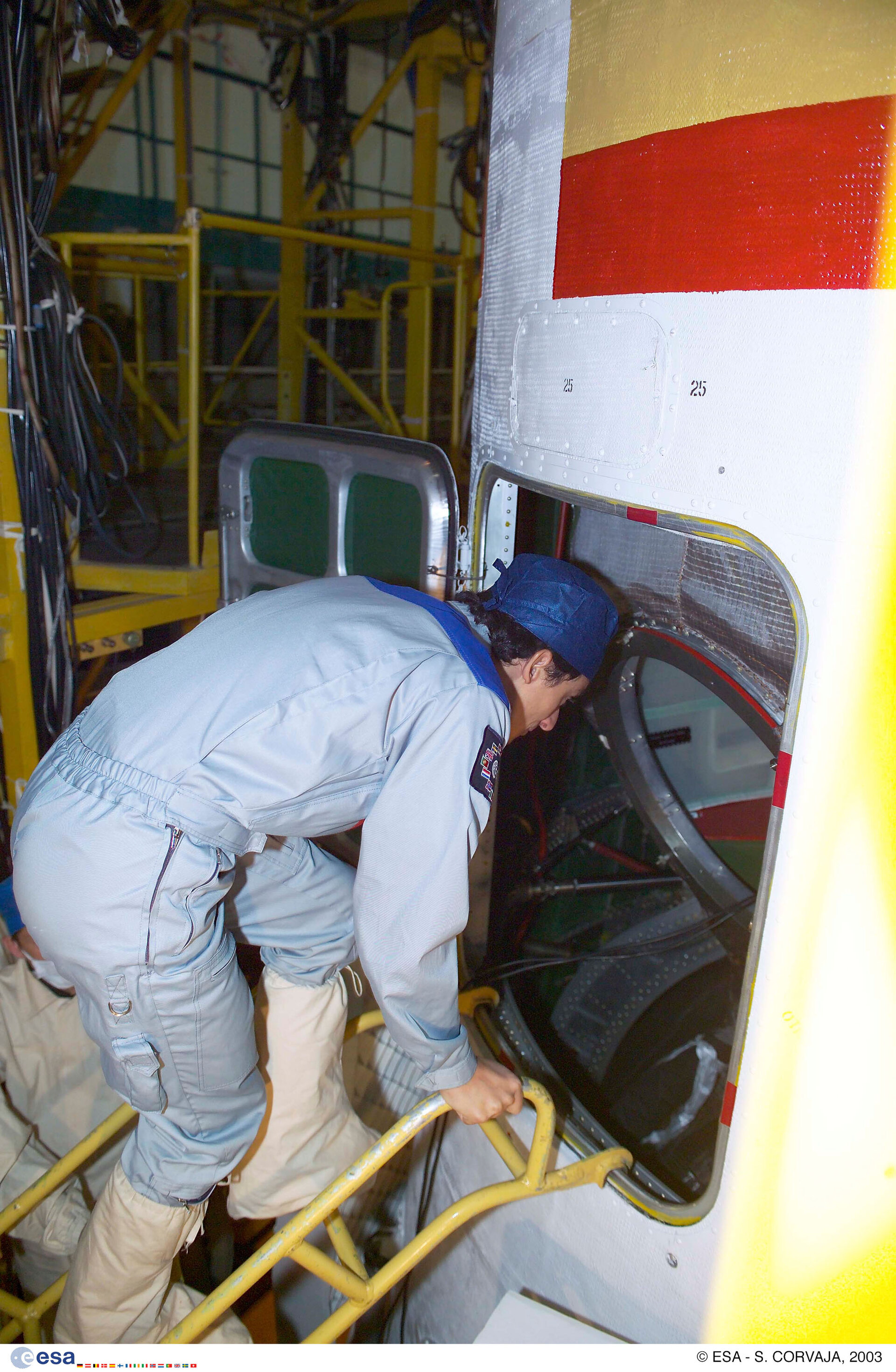 The crew inspect the Soyuz TMA-3 that will fly them to ISS