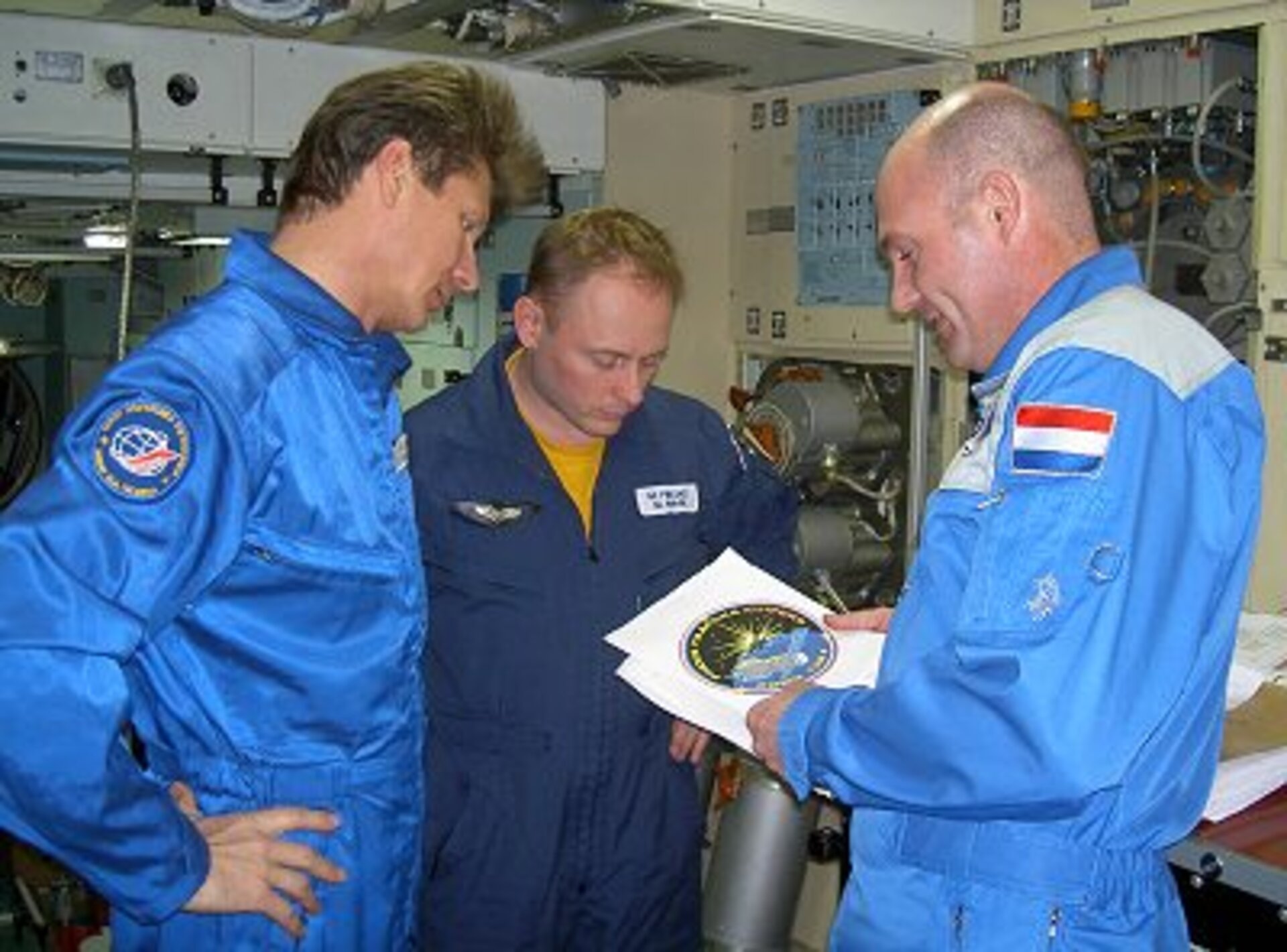 The crew discuss their mission patch