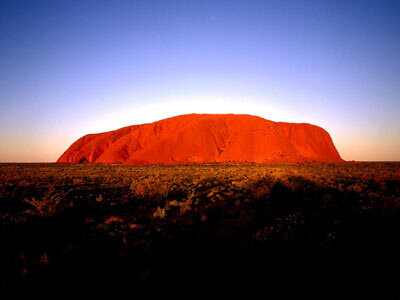 Uluru, glowing red in the desert