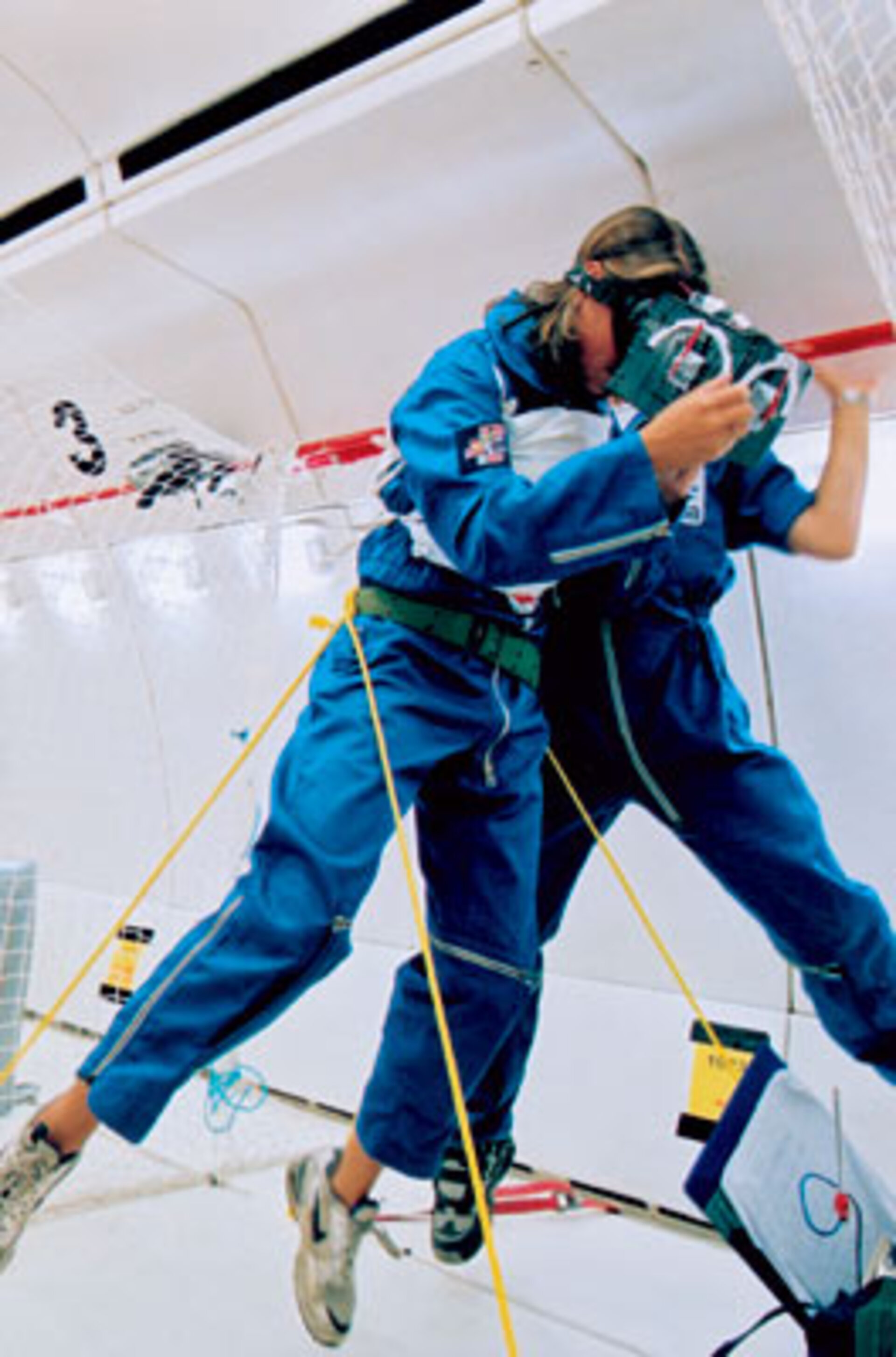 Students in weightlessness working on their experiments