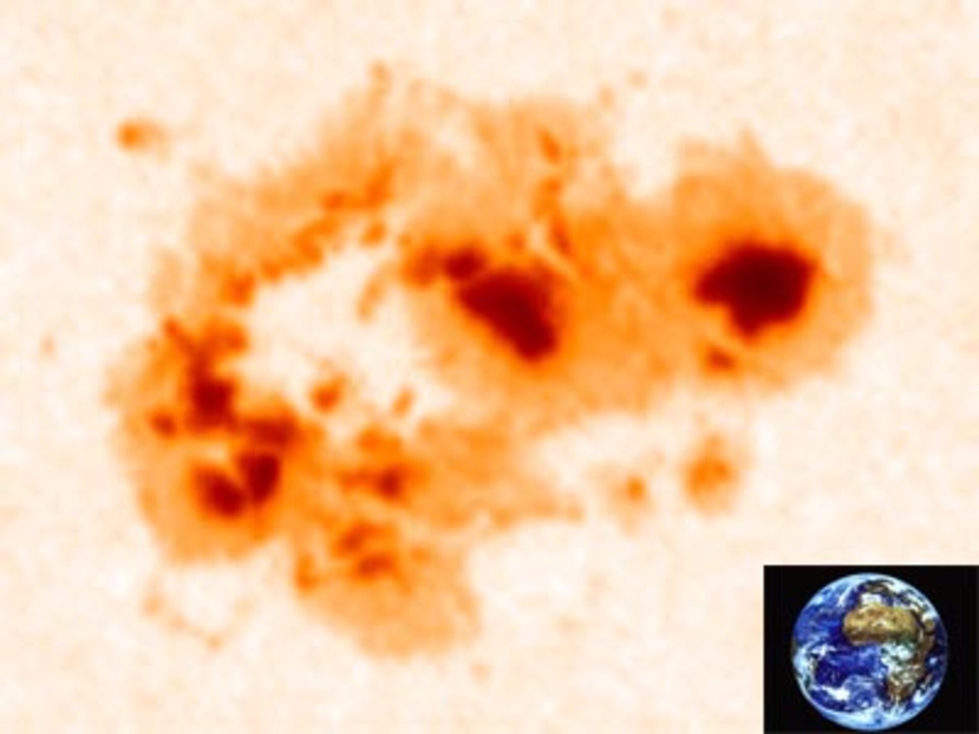 A typical sunspot and  Earth