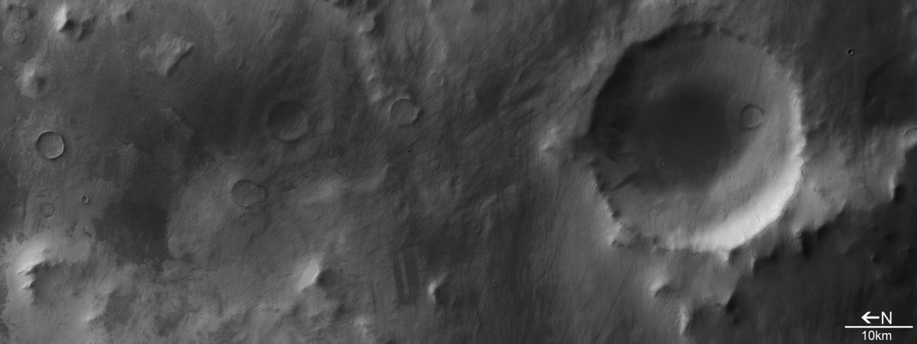 Impact crater in Promethei Terra, black and white view