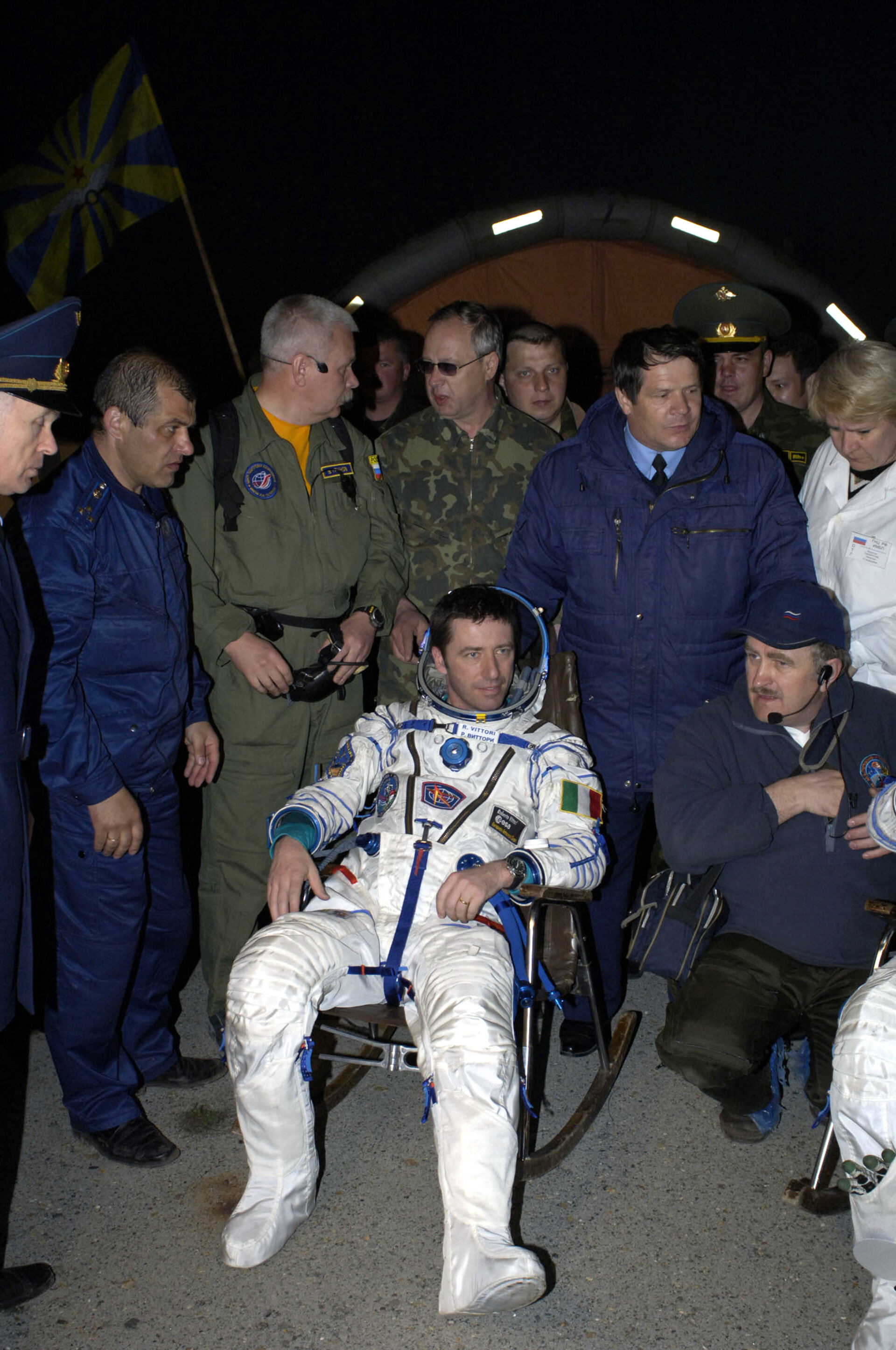 Roberto Vittori is helped out of the Soyuz TMA-5 capsule shortly after landing