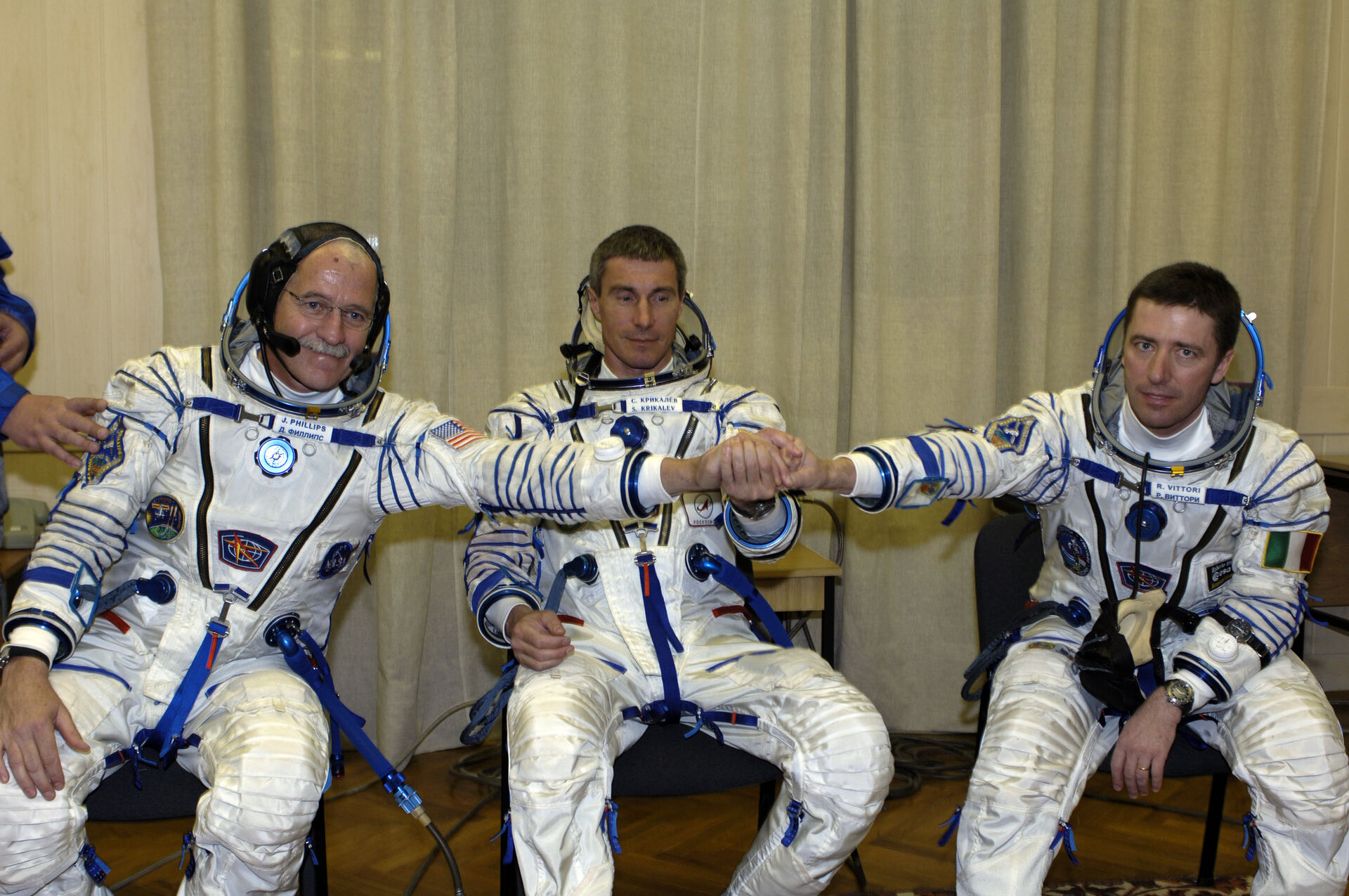 Soyuz TMA-6 crew during the final check of their Sokol pressure suits
