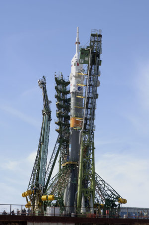 The arms of the launch pad enclose the Soyuz launcher