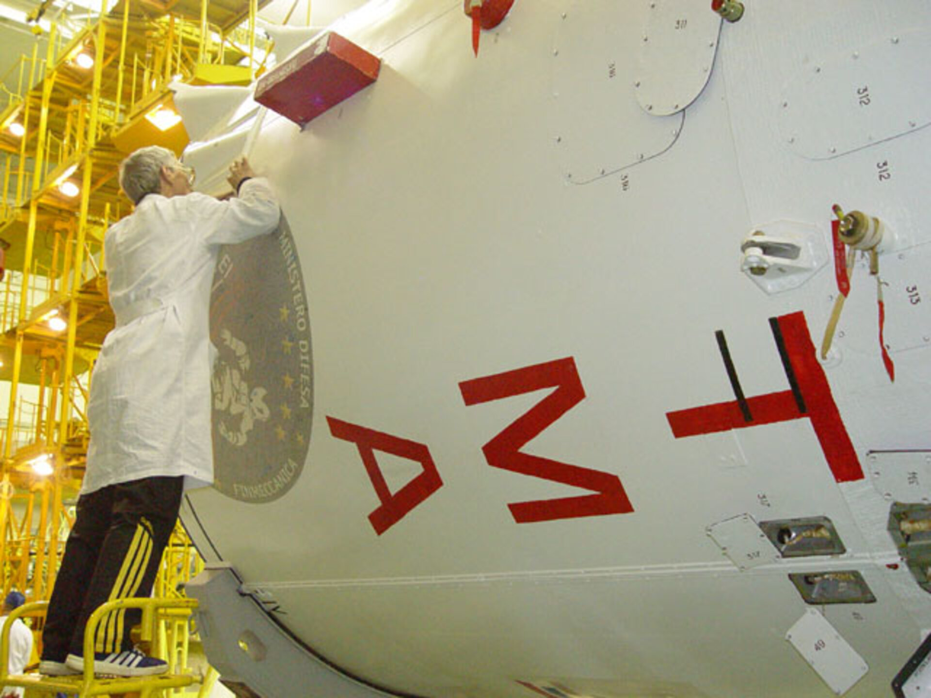 The Eneide Mission logo being placed on the Soyuz launcher