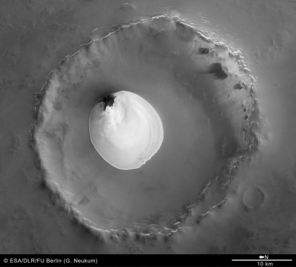 Black and white view of crater with water ice