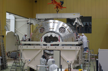 Columbus laboratory is lowered into container ahead of transportation to Florida