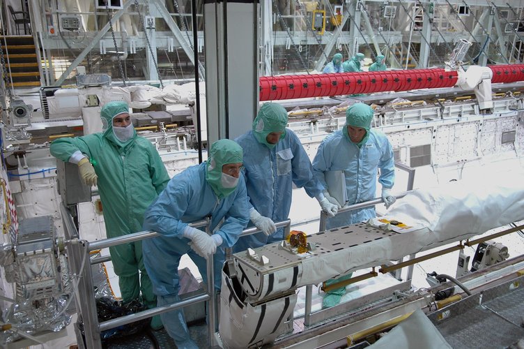 STS-115 crew members inspect equipment in Atlantis's payload bay