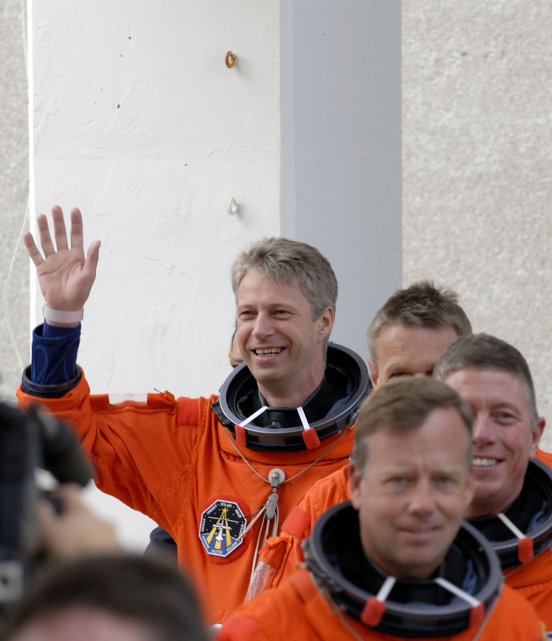 Thomas Reiter and fellow STS-121 crewmembers on their way to the practice countdown at Kennedy Space Center