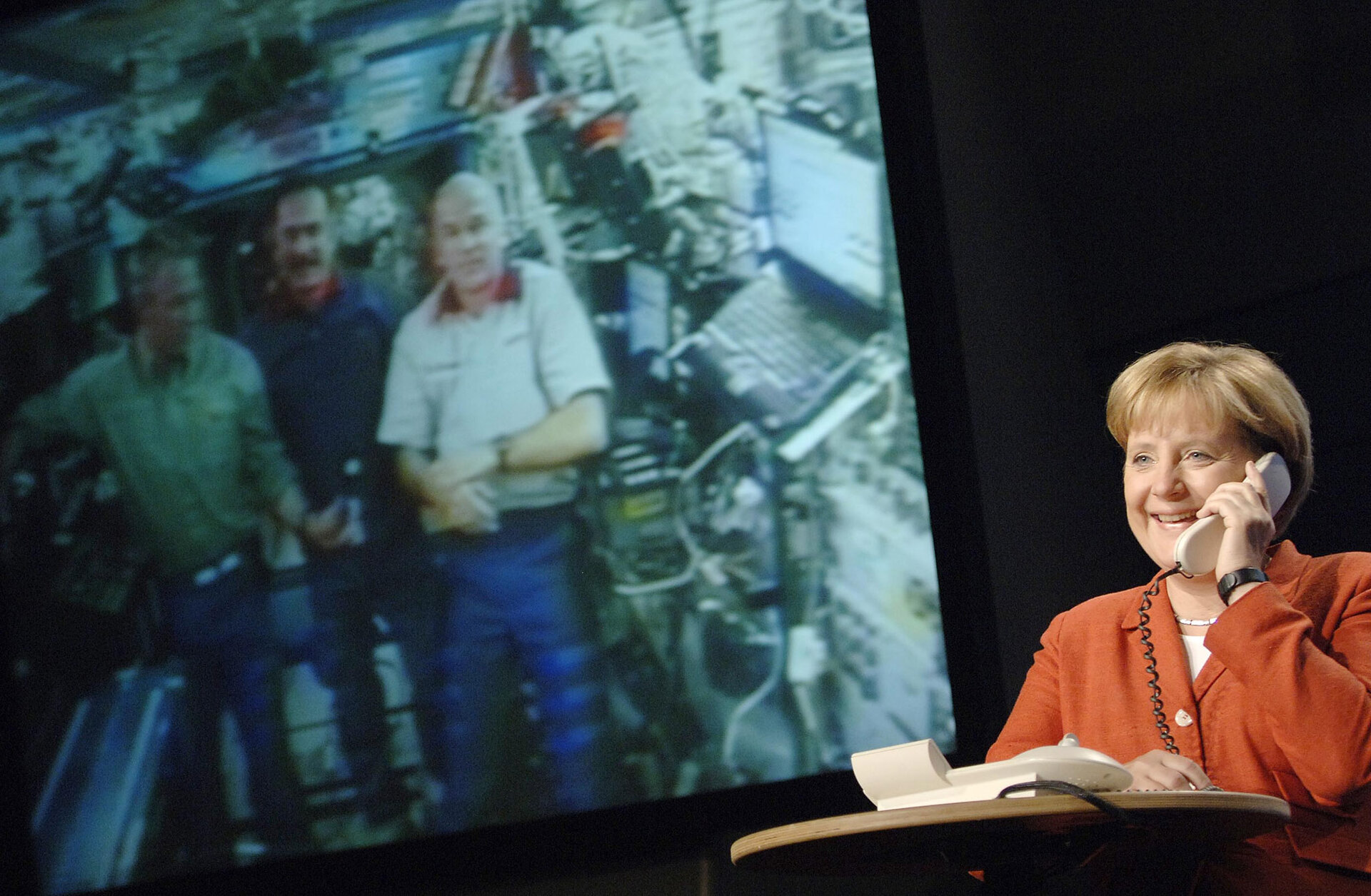 German Chancellor Merkel speaks with ESA astronaut Reiter