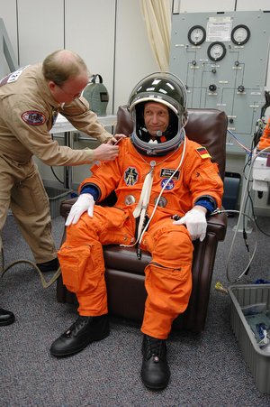 Thomas Reiter is helped with his launch suit before heading to Launch Pad 39B
