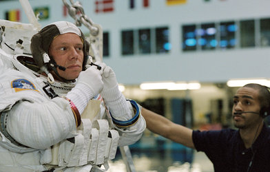 Astronaut Christer Fuglesang prepares for underwater training in Extravehicular Mobility Unit (EMU) spacesuit