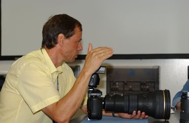 Christer Fuglesang practices with a camera during training