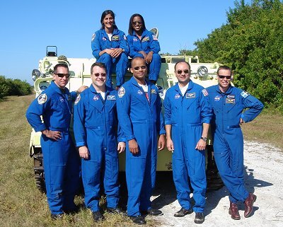 The crew in front of the armoured carrier