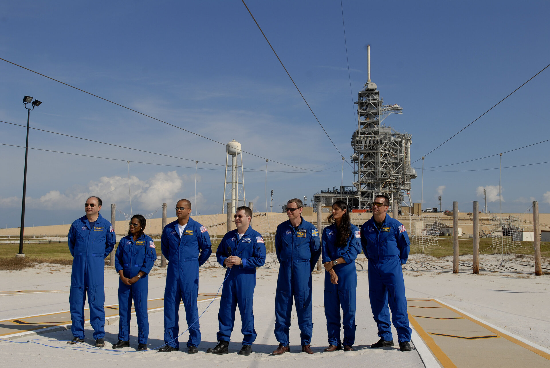 ESA astronaut Christer Fuglesang and the crew of the STS-116 Space Shuttle mission near the launch pad area