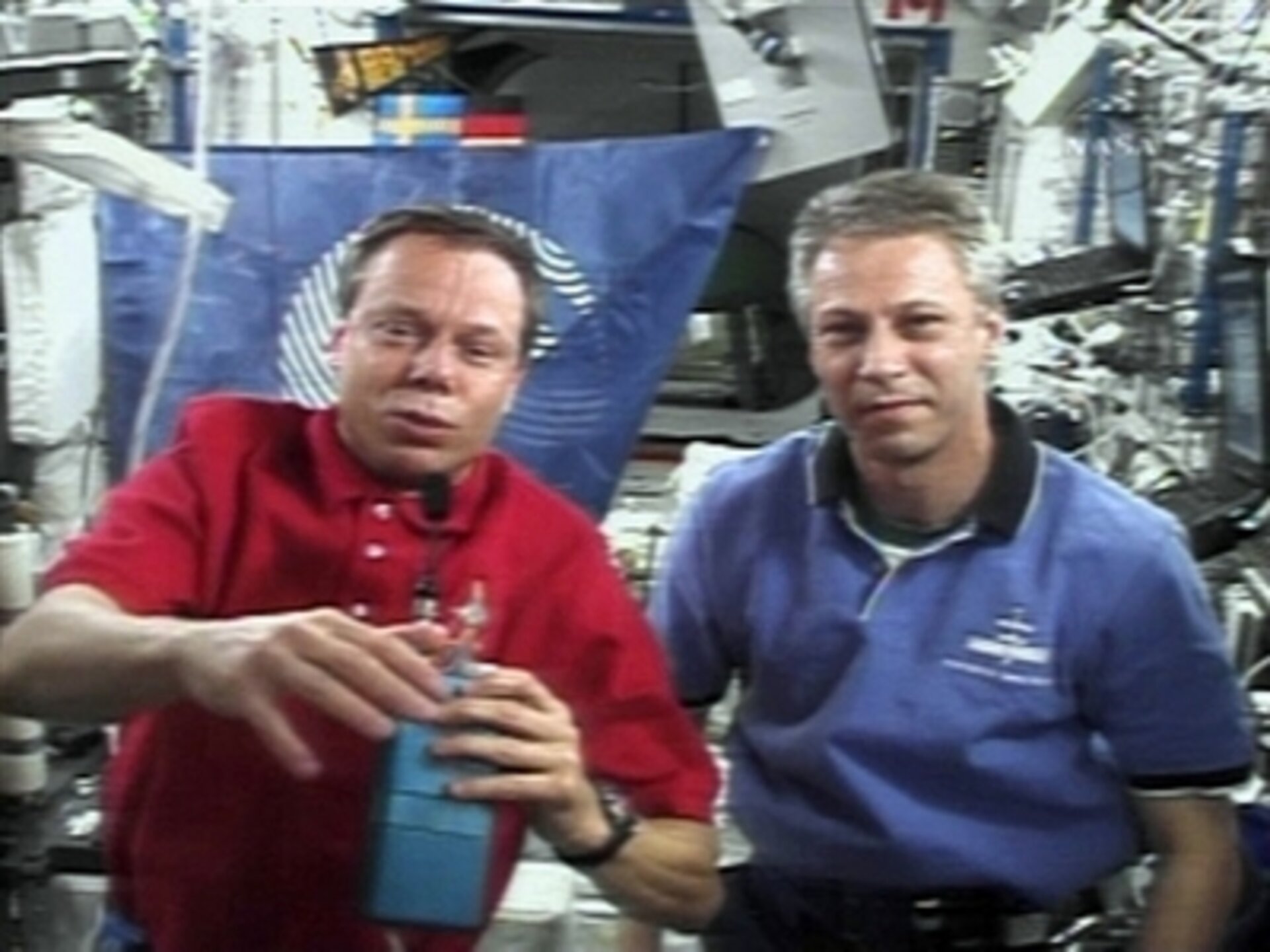 ESA astronauts Christer Fuglesang and Thomas Reiter during an inflight call with Crown Princess Victoria of Sweden