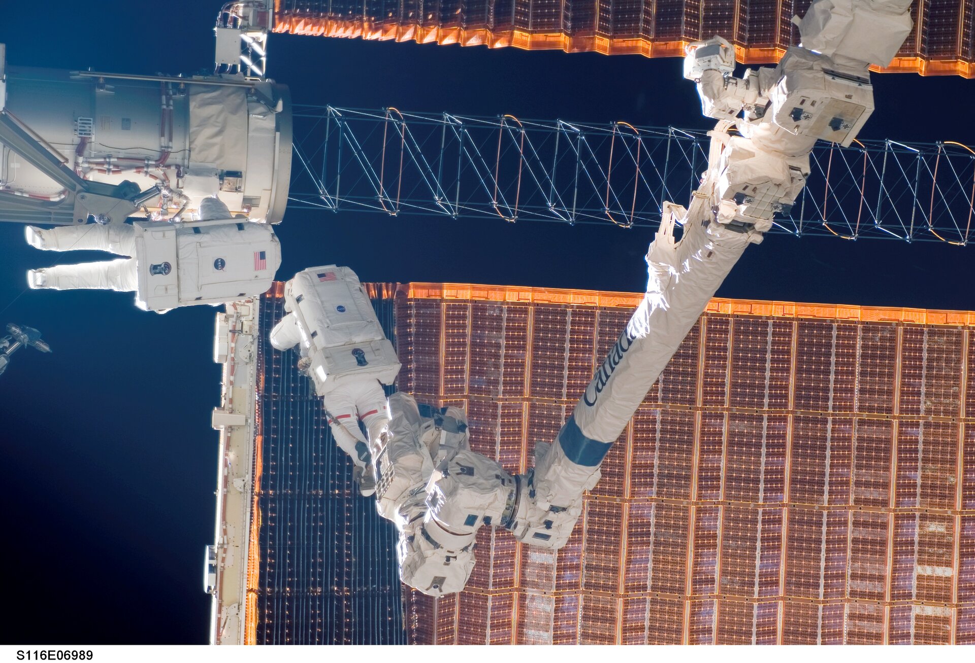 Fuglesang and Curbeam work to fix the Station's jammed solar array