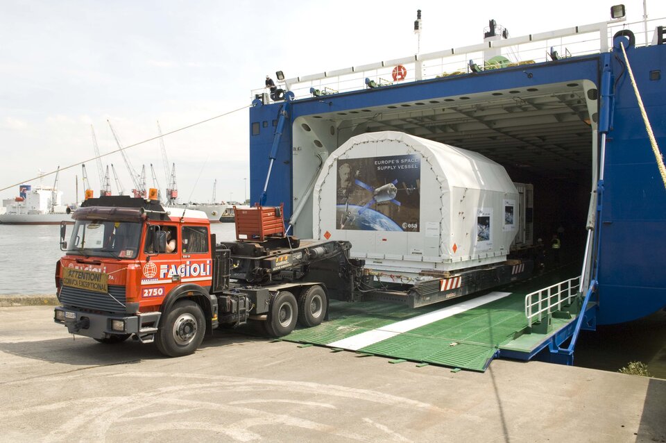 The trucks are reversed onto the cargo ship MN Toucan