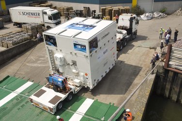 The trucks are reversed onto the cargo ship MN Toucan