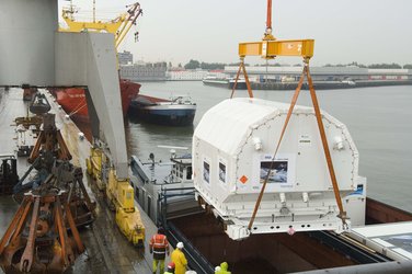 Unloading the containers from the canal barge at Rotterdam harbour