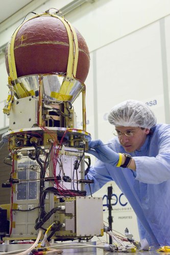 A student engineer works on YES2 ejection module
