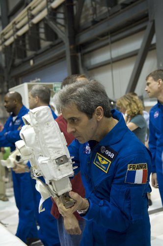 ESA astronaut Leopold Eyharts practices using camera during inspection of Space Shuttle Atlantis