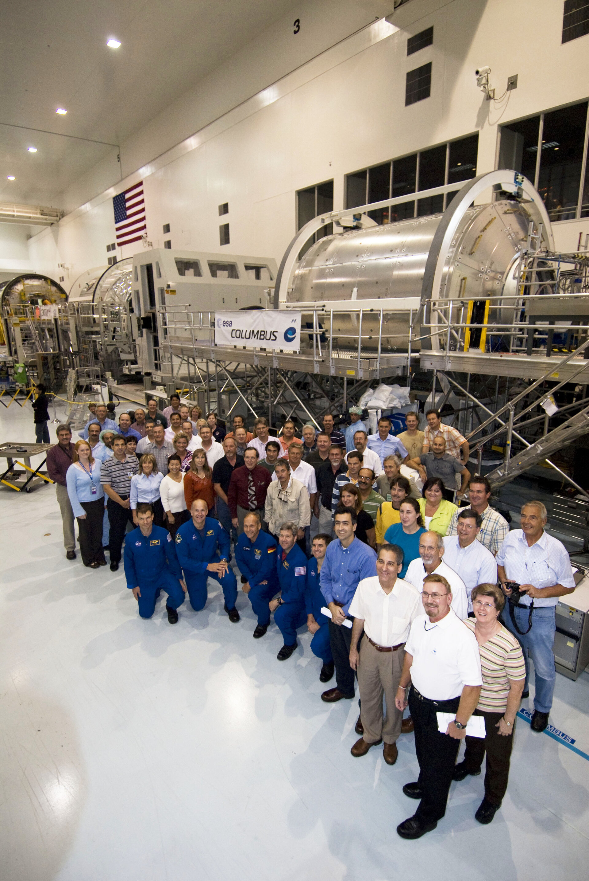 STS-122 astronauts and support team with the European Columbus laboratory
