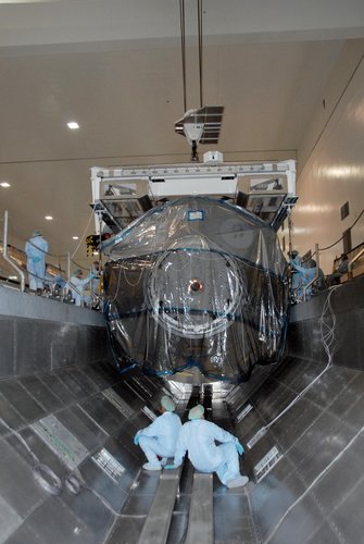 The European Columbus laboratory is lowered into the payload canister