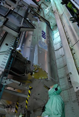 The European Columbus laboratory is transferred into Space Shuttle Atlantis' payload bay