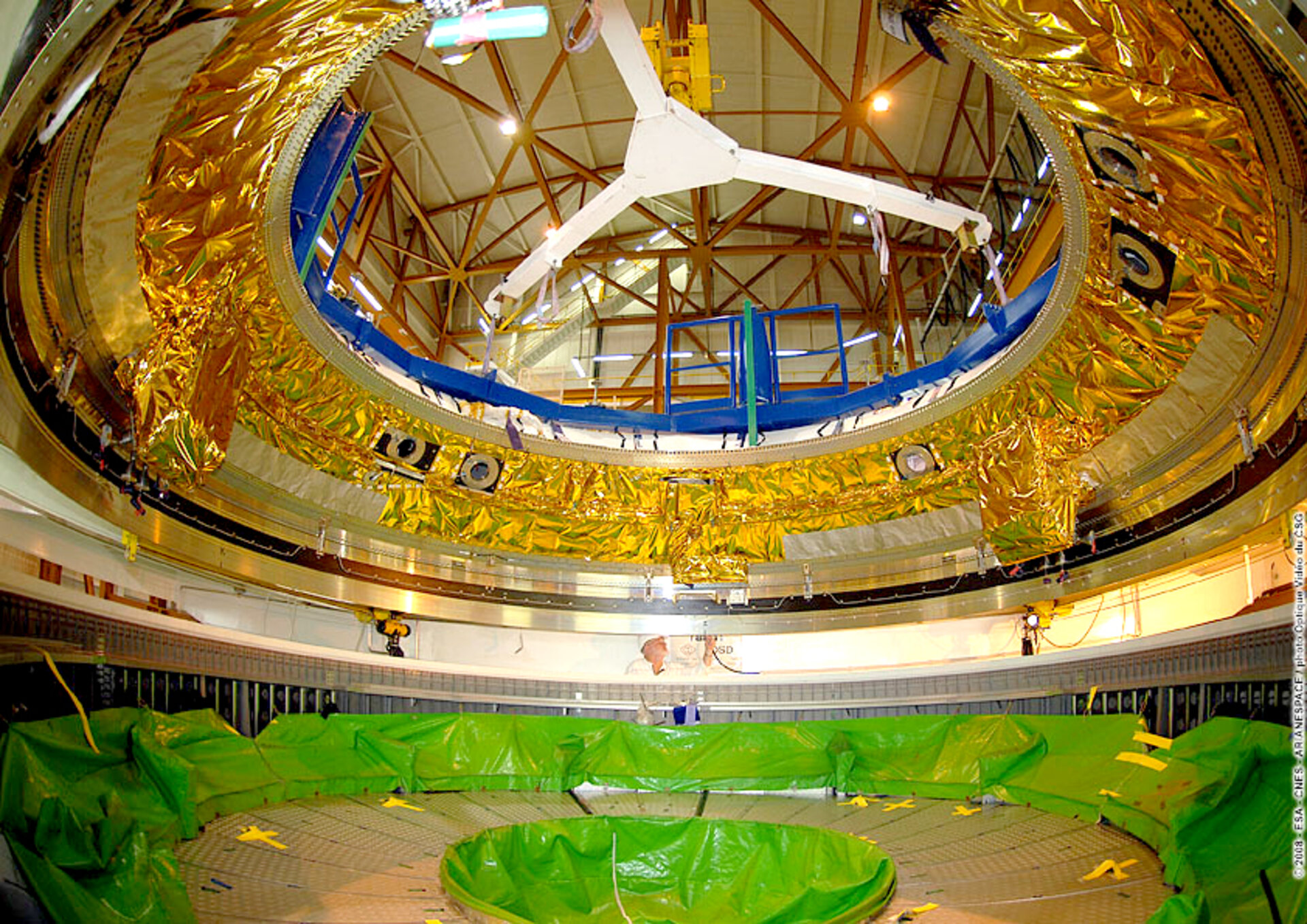 Engineers at Europe's Spaceport in Kourou, French Guiana, prepare the Ariane 5 ES ATV for the Jules Verne flight