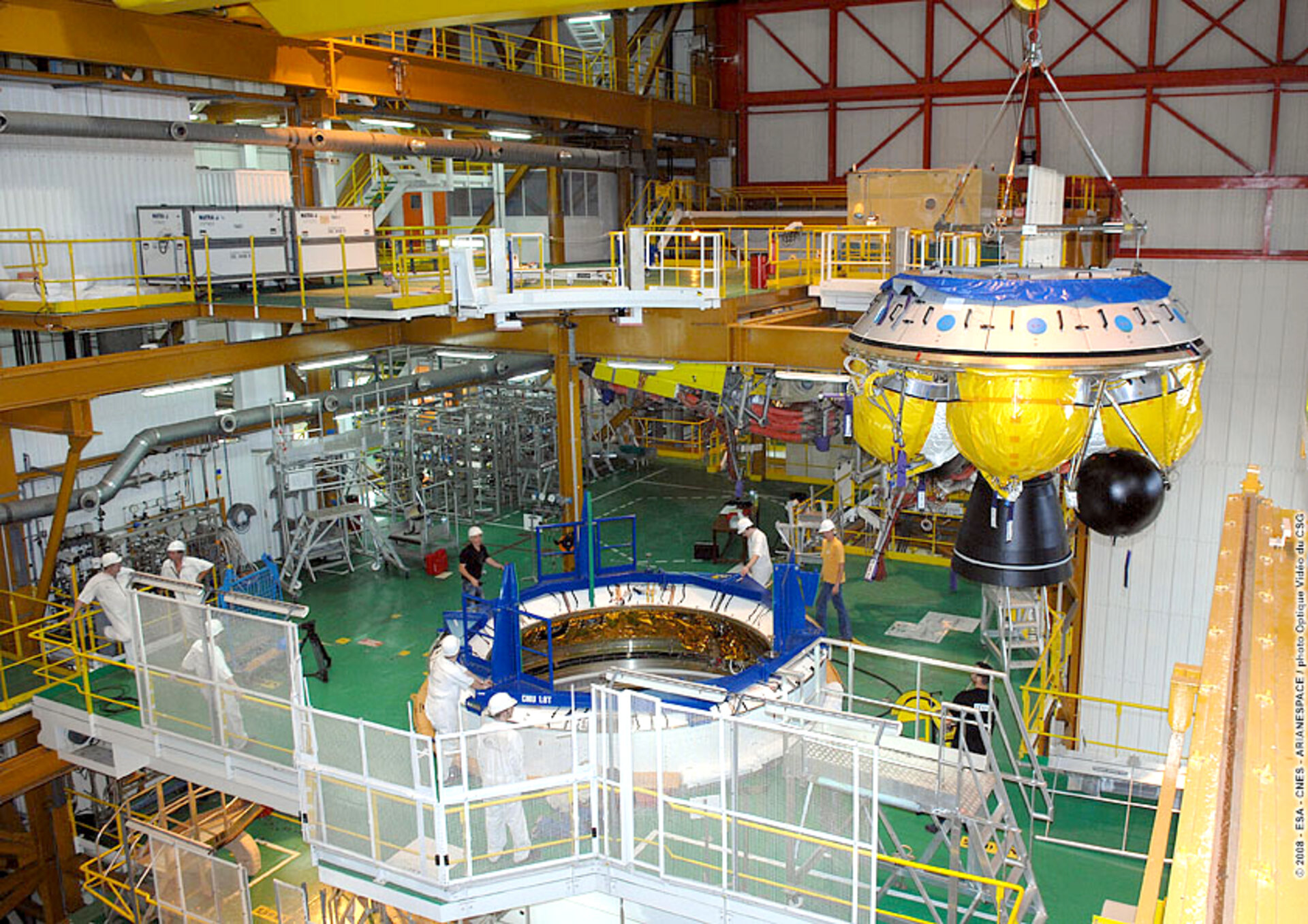 Engineers at Europe's Spaceport in Kourou, French Guiana, prepare the Ariane 5 ES ATV for the Jules Verne flight