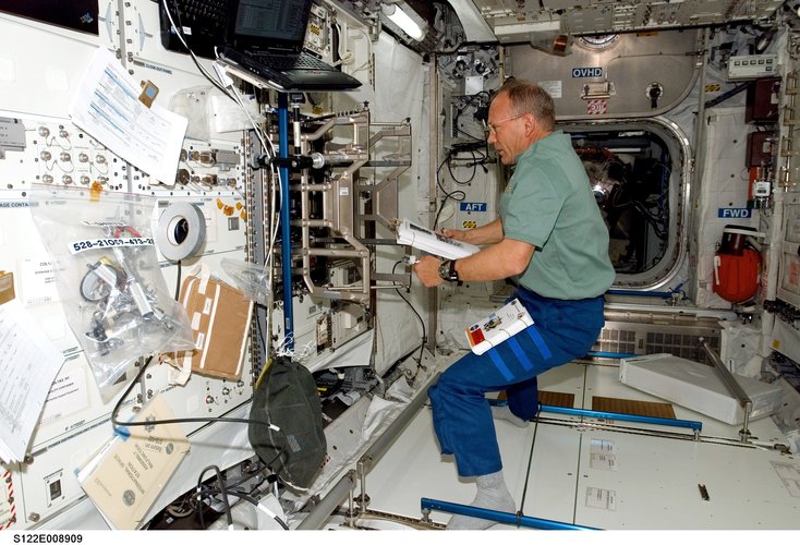 ESA astronaut Hans Schlegel works toward readying the European Columbus laboratory