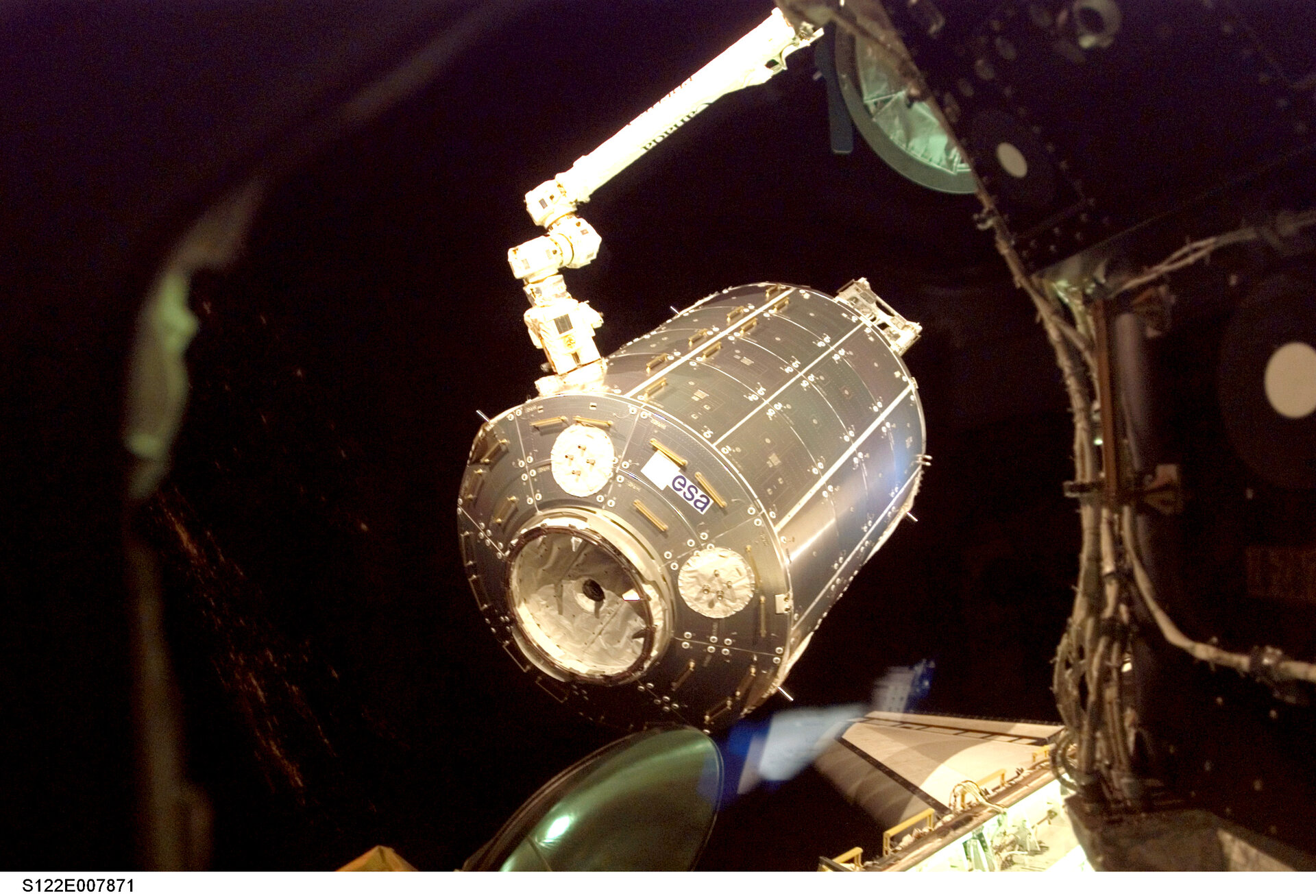 Lifting Columbus out of Atlantis' payload bay