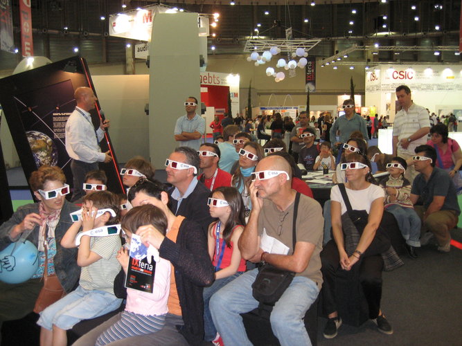 General public watching 3D images on display