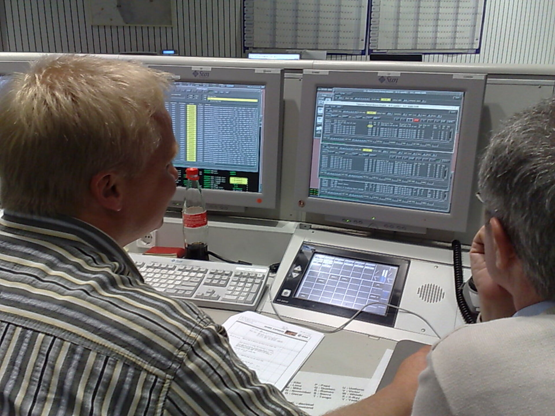 P. Schmitz (L) and P. Ferri (R) monitor first receipt of MELACOM data